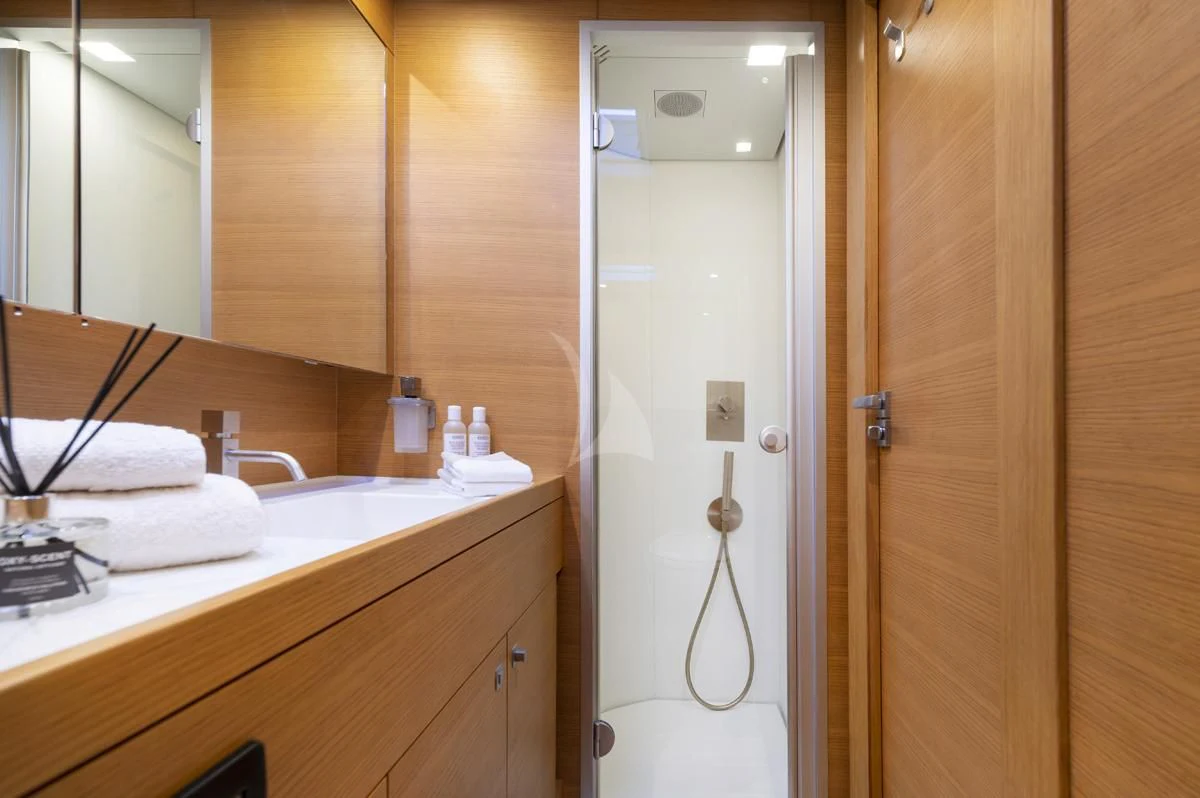 a bathroom with a shower unit and sink aboard BLACK LION Yacht for Sale