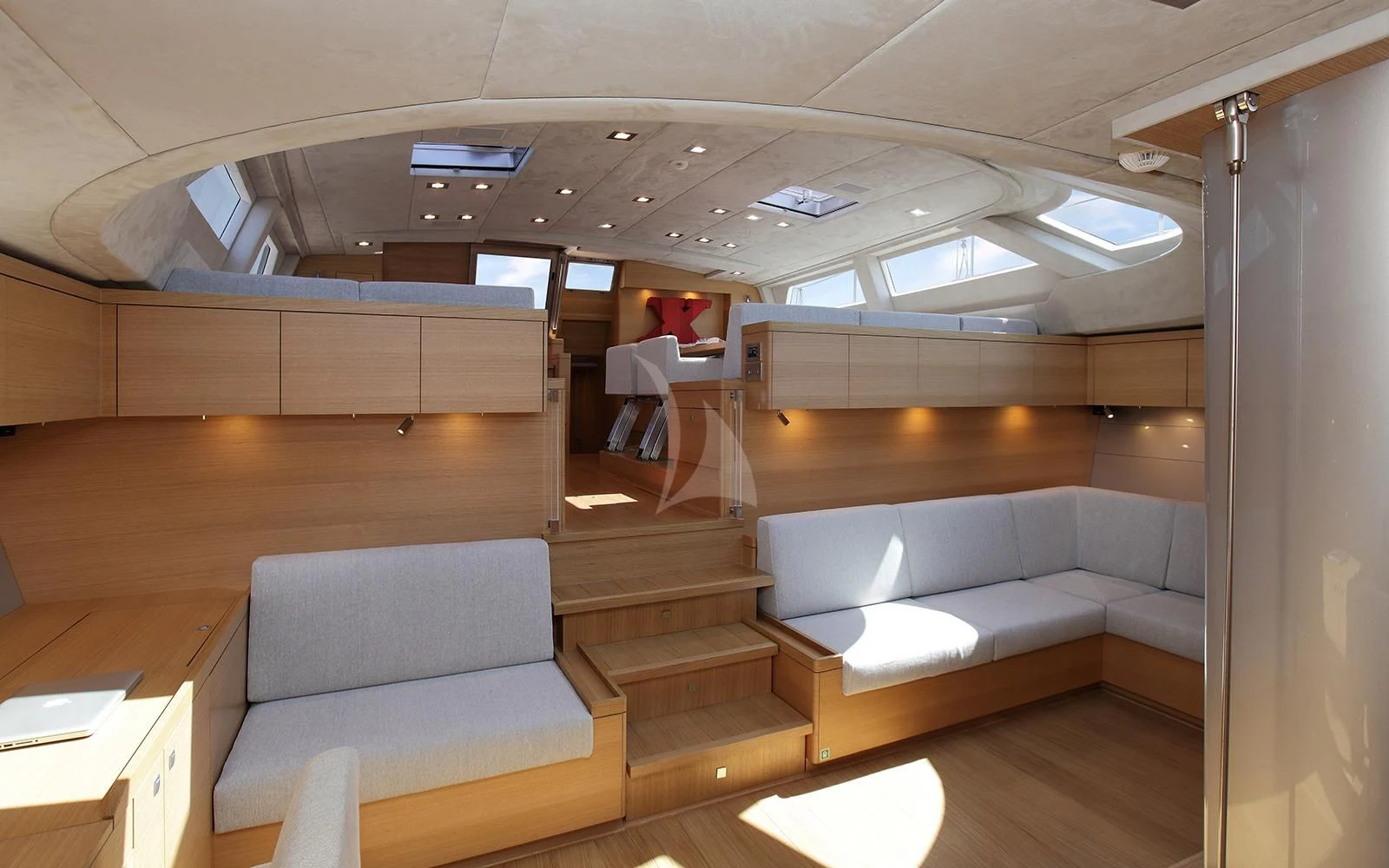 a room with couches and a table aboard BLACK LION Yacht for Sale