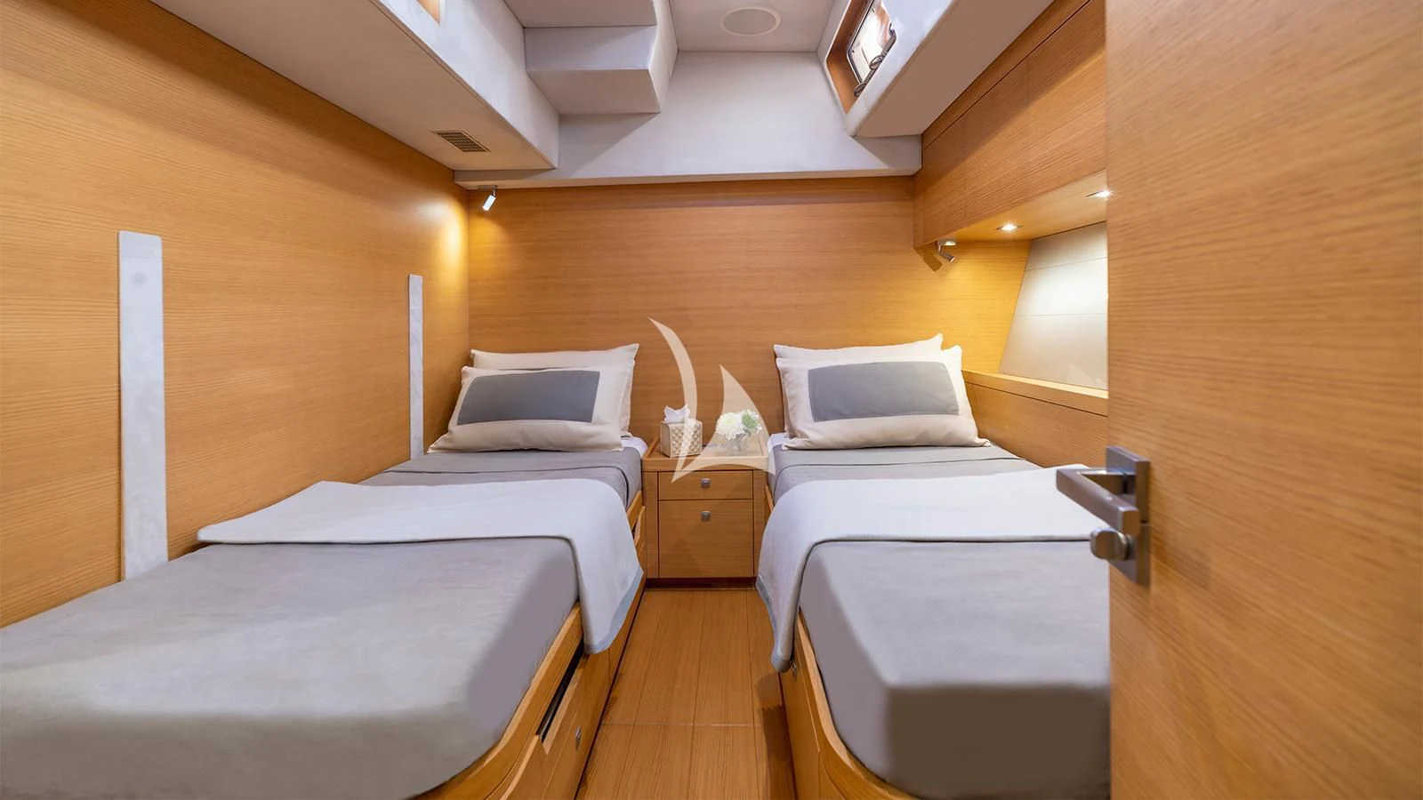 a room with beds and a wood wall aboard BLACK LION Yacht for Sale
