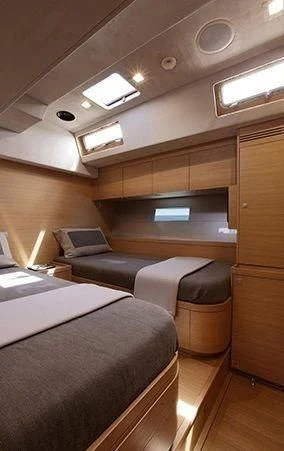 a room with a bed and a desk aboard BLACK LION Yacht for Sale