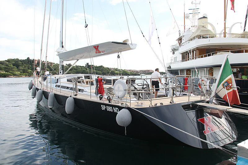 a boat with a flag on the front aboard BLACK LION Yacht for Sale