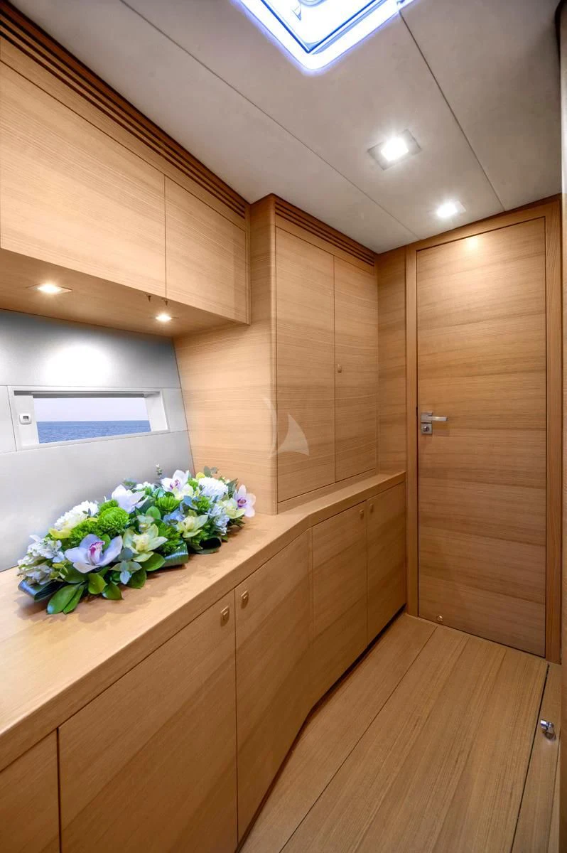 a wooden kitchen with a countertop aboard BLACK LION Yacht for Sale