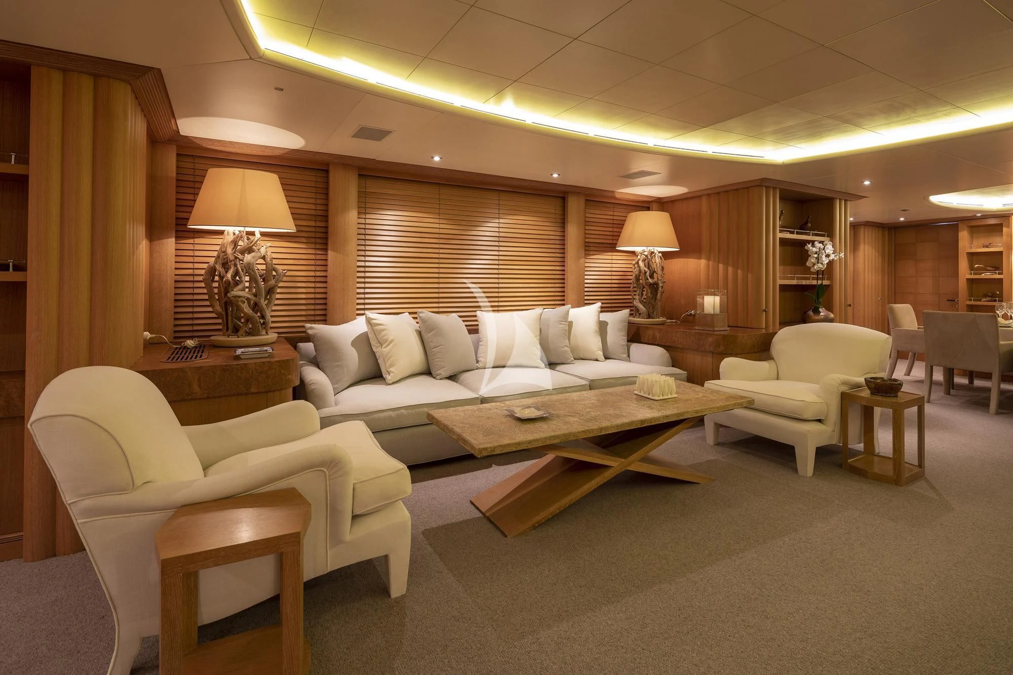 a living room with a couch and a table aboard ALEXANDRA Yacht for Charter