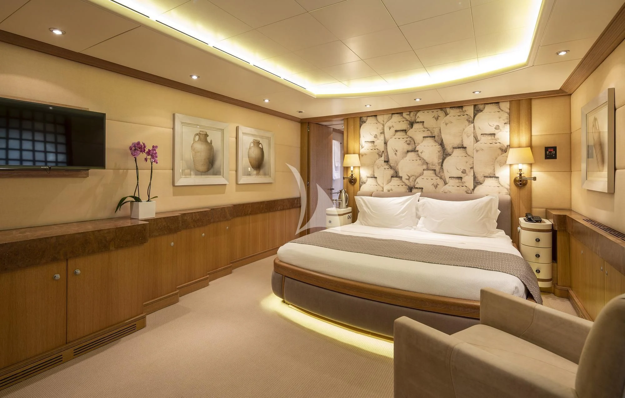 a room with a bed and a couch aboard ALEXANDRA Yacht for Charter
