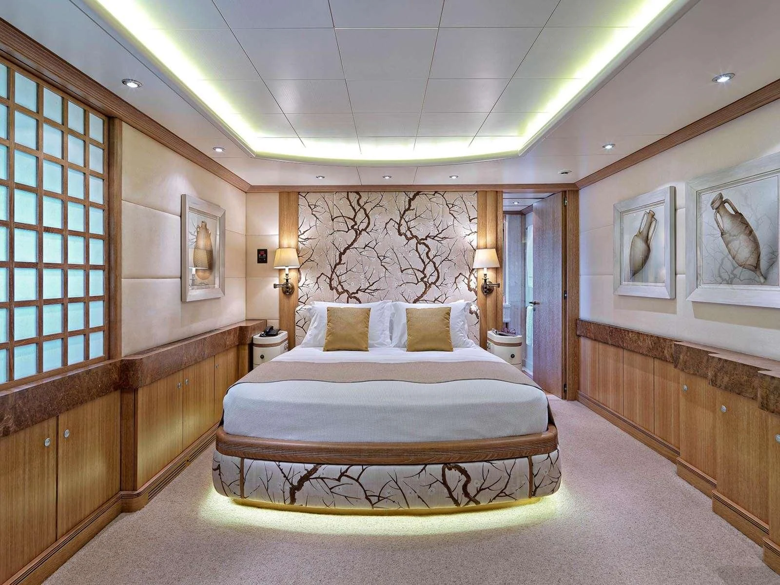 a large bed in a room aboard ALEXANDRA Yacht for Charter
