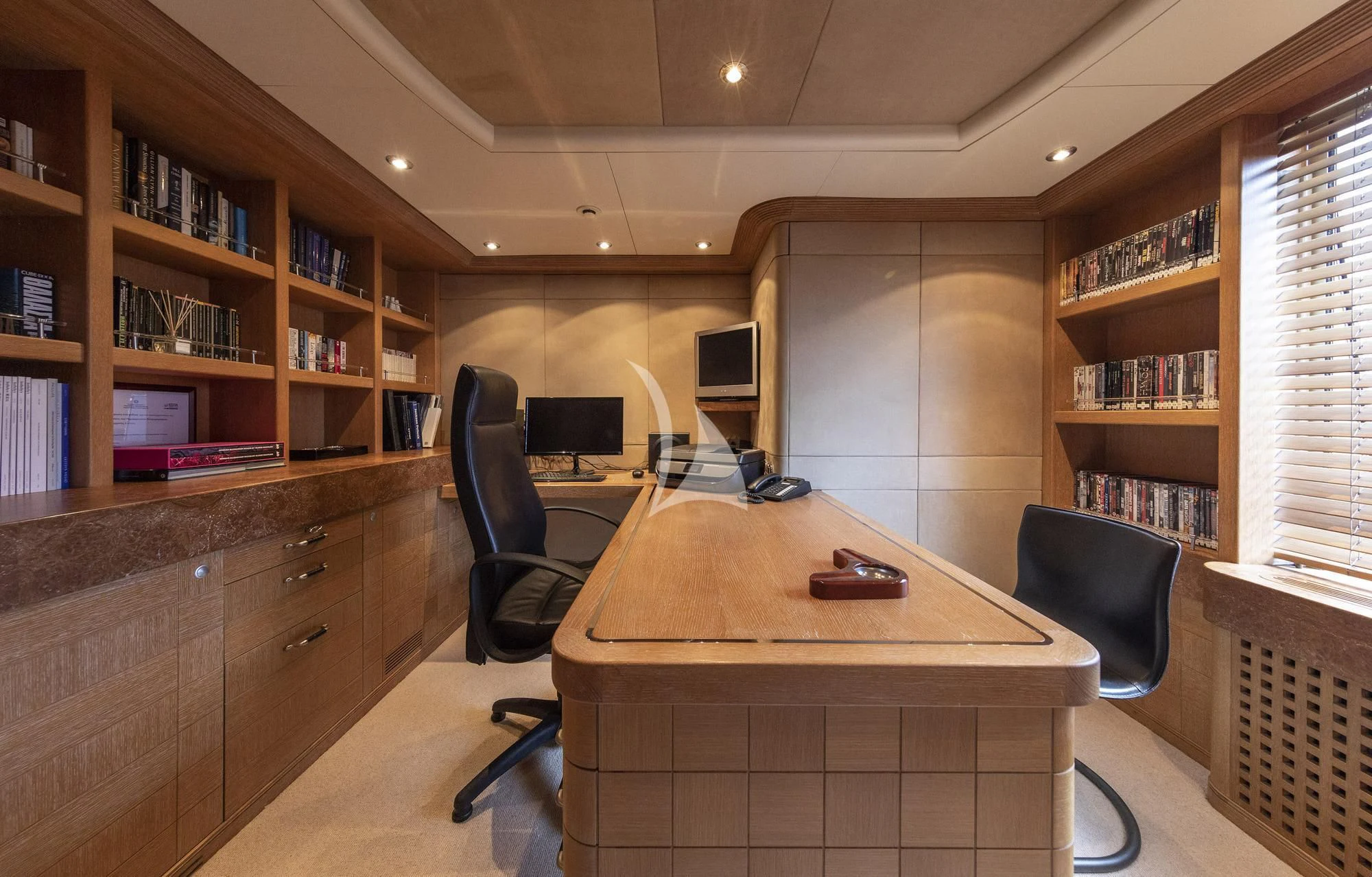 a room with a desk and computer aboard ALEXANDRA Yacht for Charter