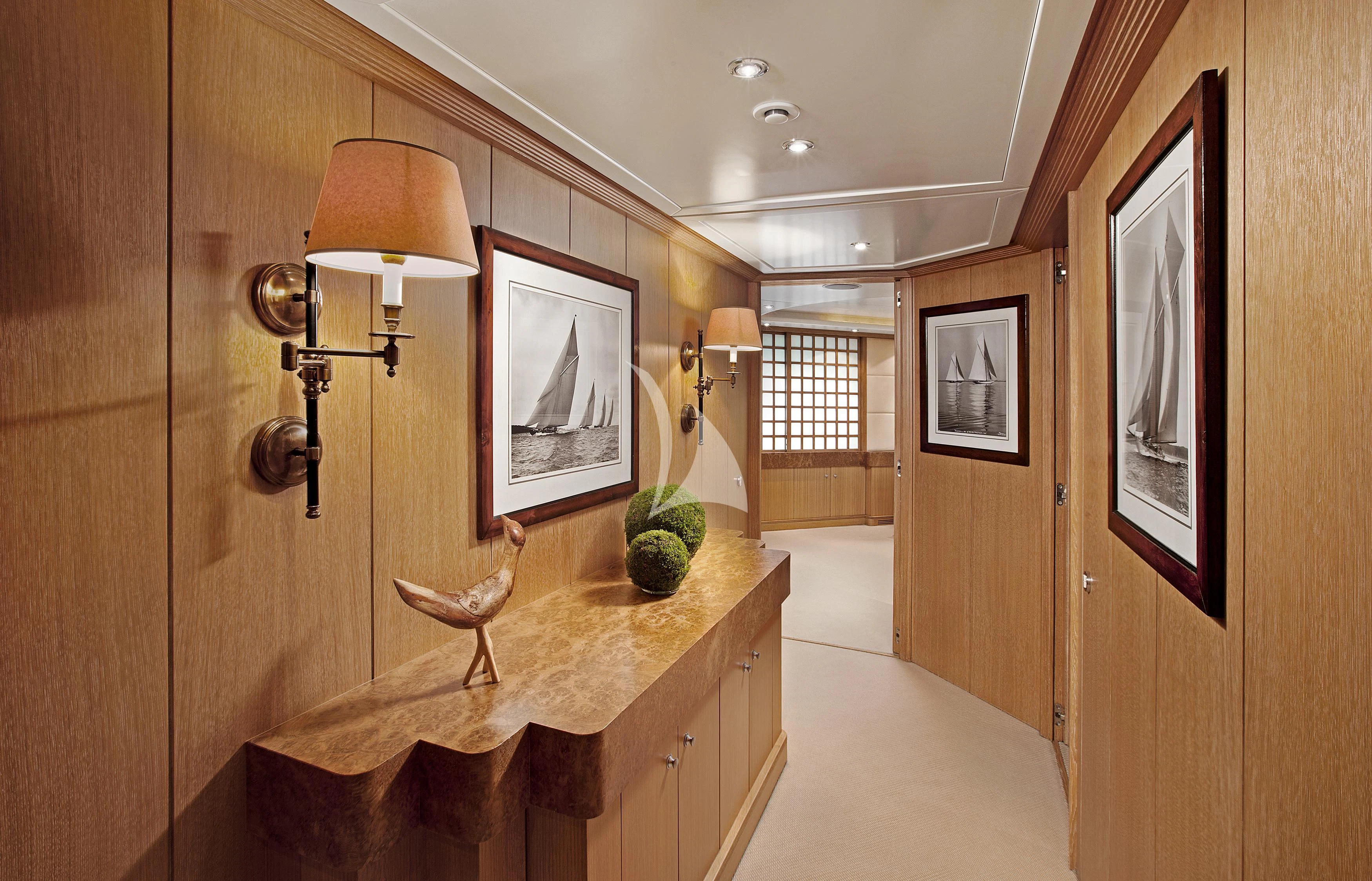 a bathroom with a wood counter and a lamp on the counter aboard ALEXANDRA Yacht for Charter