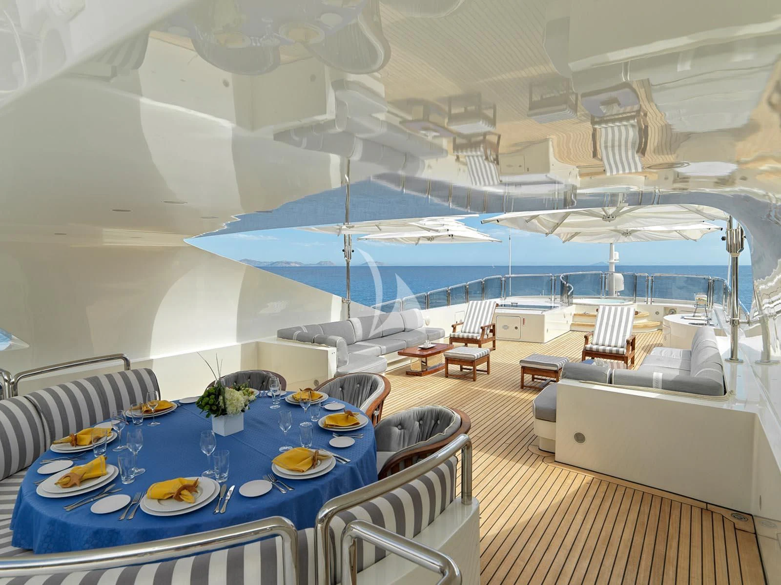 a tent with a table and chairs aboard ALEXANDRA Yacht for Charter