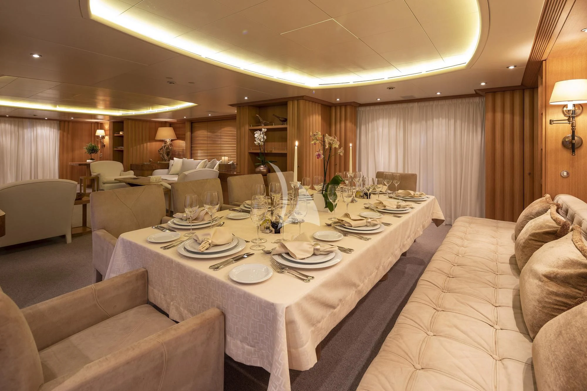 a large dining room with a large table set for dinner aboard ALEXANDRA Yacht for Charter