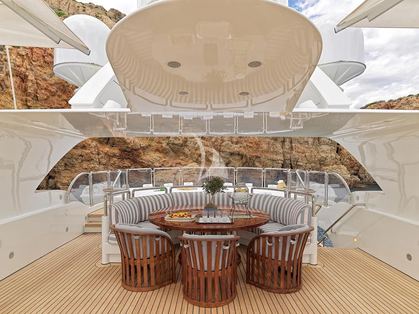 a room with tables and chairs aboard ALEXANDRA Yacht for Charter