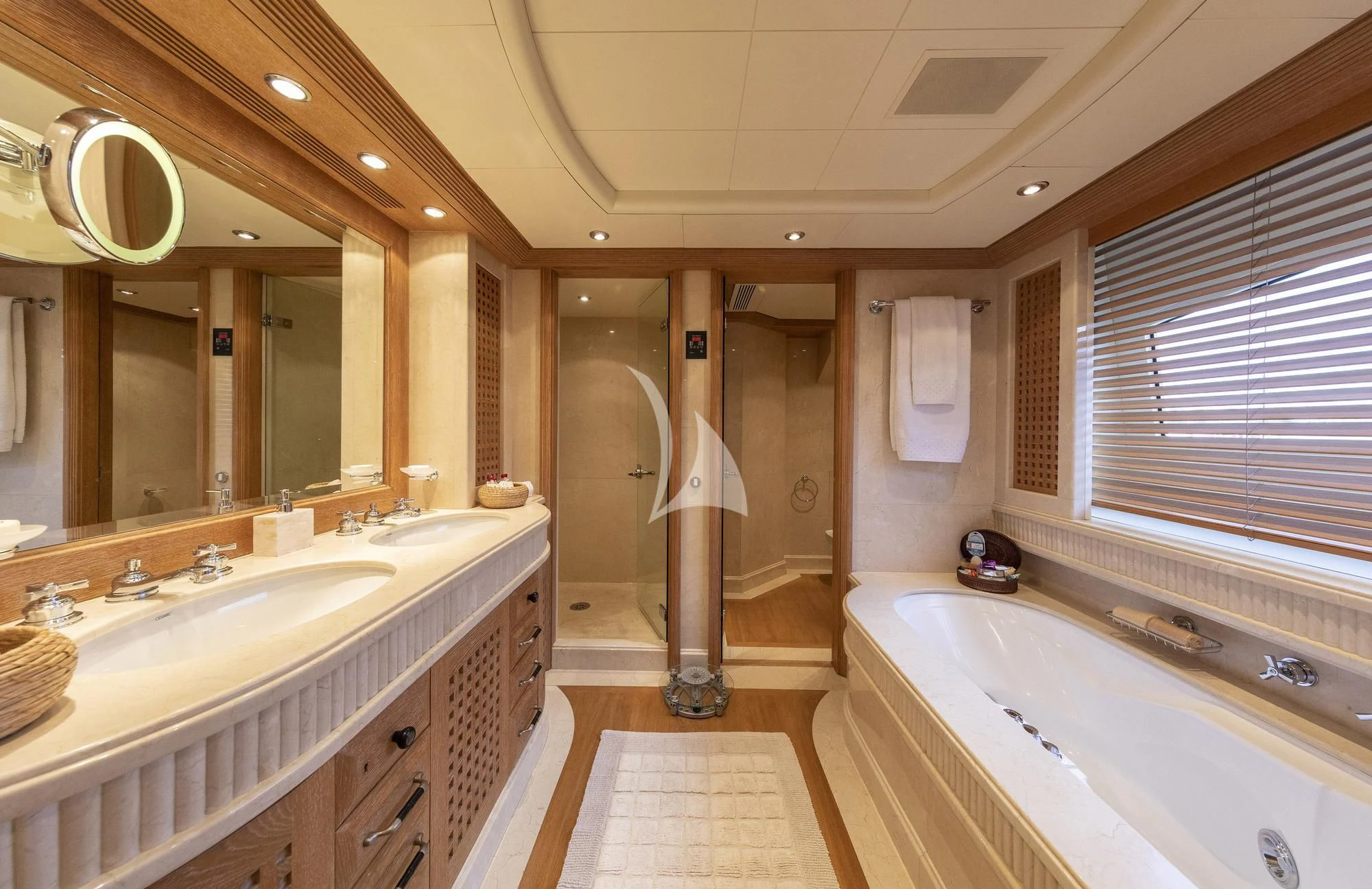 a bathroom with a tub sink and a sink aboard ALEXANDRA Yacht for Charter