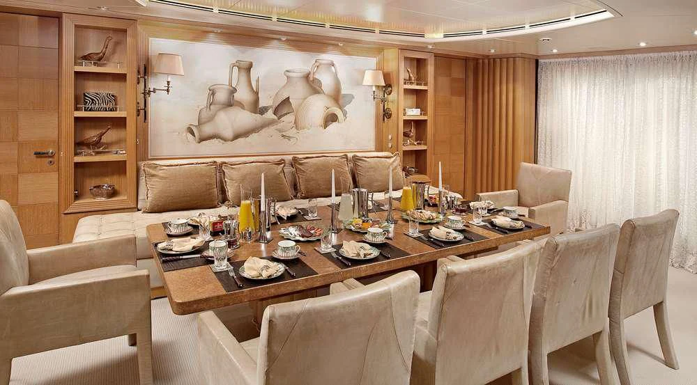 a dining table in a room aboard ALEXANDRA Yacht for Charter