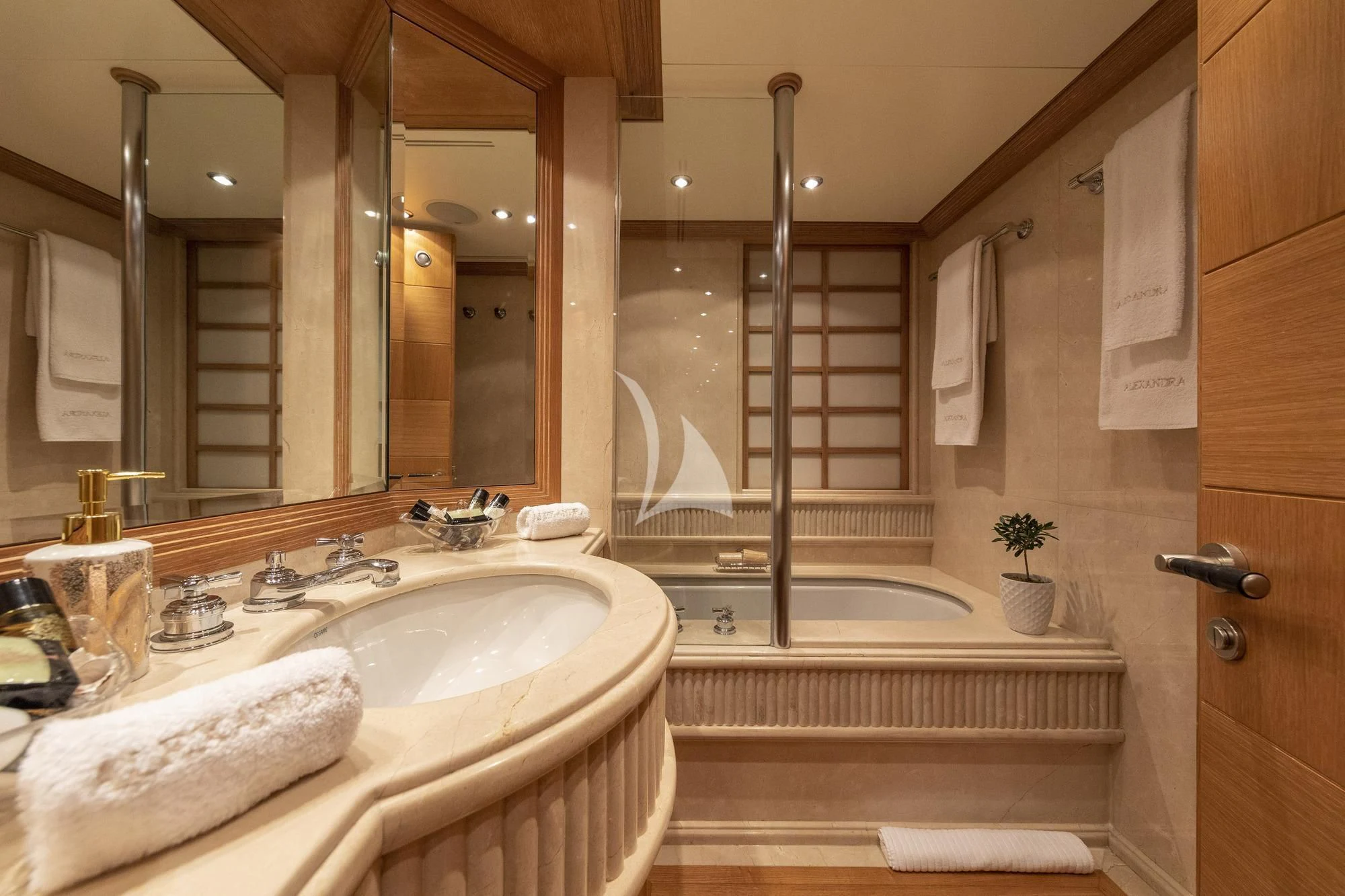 a bathroom with a large glass shower aboard ALEXANDRA Yacht for Charter