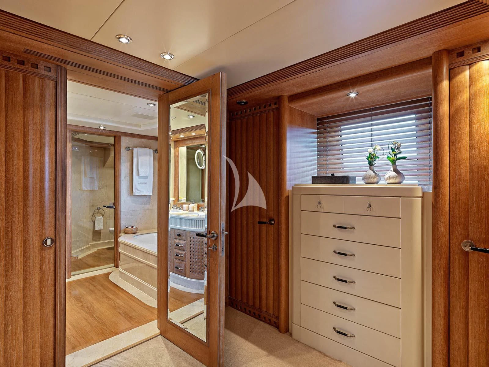 a room with a closet and a bed aboard ALEXANDRA Yacht for Charter