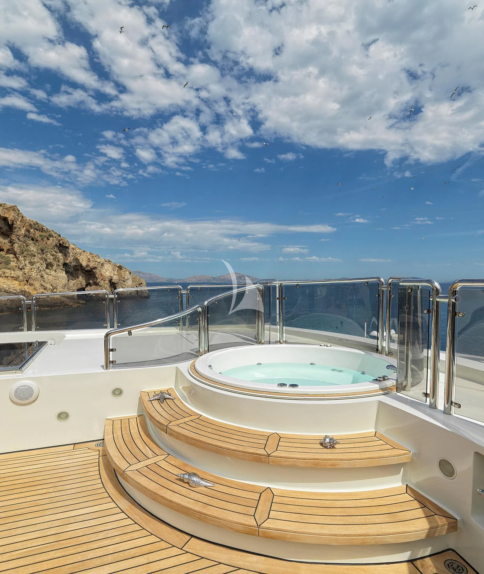 a large swimming pool aboard ALEXANDRA Yacht for Charter