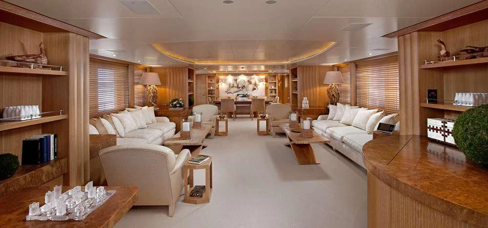 a living room with a couch and a table aboard ALEXANDRA Yacht for Charter