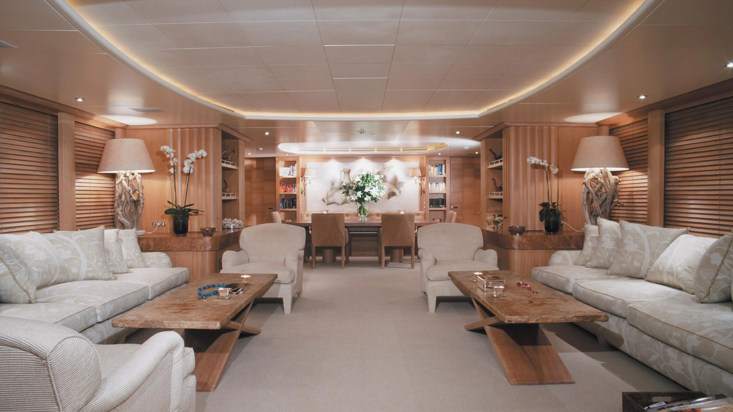 a living room with a couch and a coffee table aboard ALEXANDRA Yacht for Charter