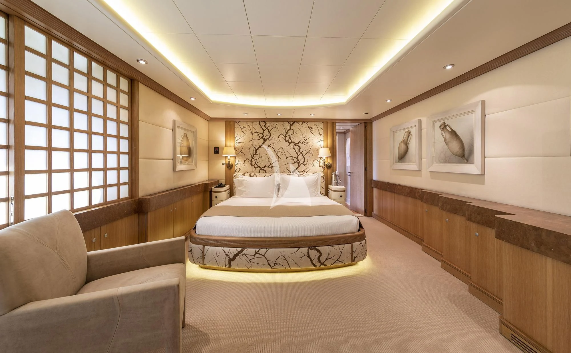a large bedroom with a bed and a couch aboard ALEXANDRA Yacht for Charter