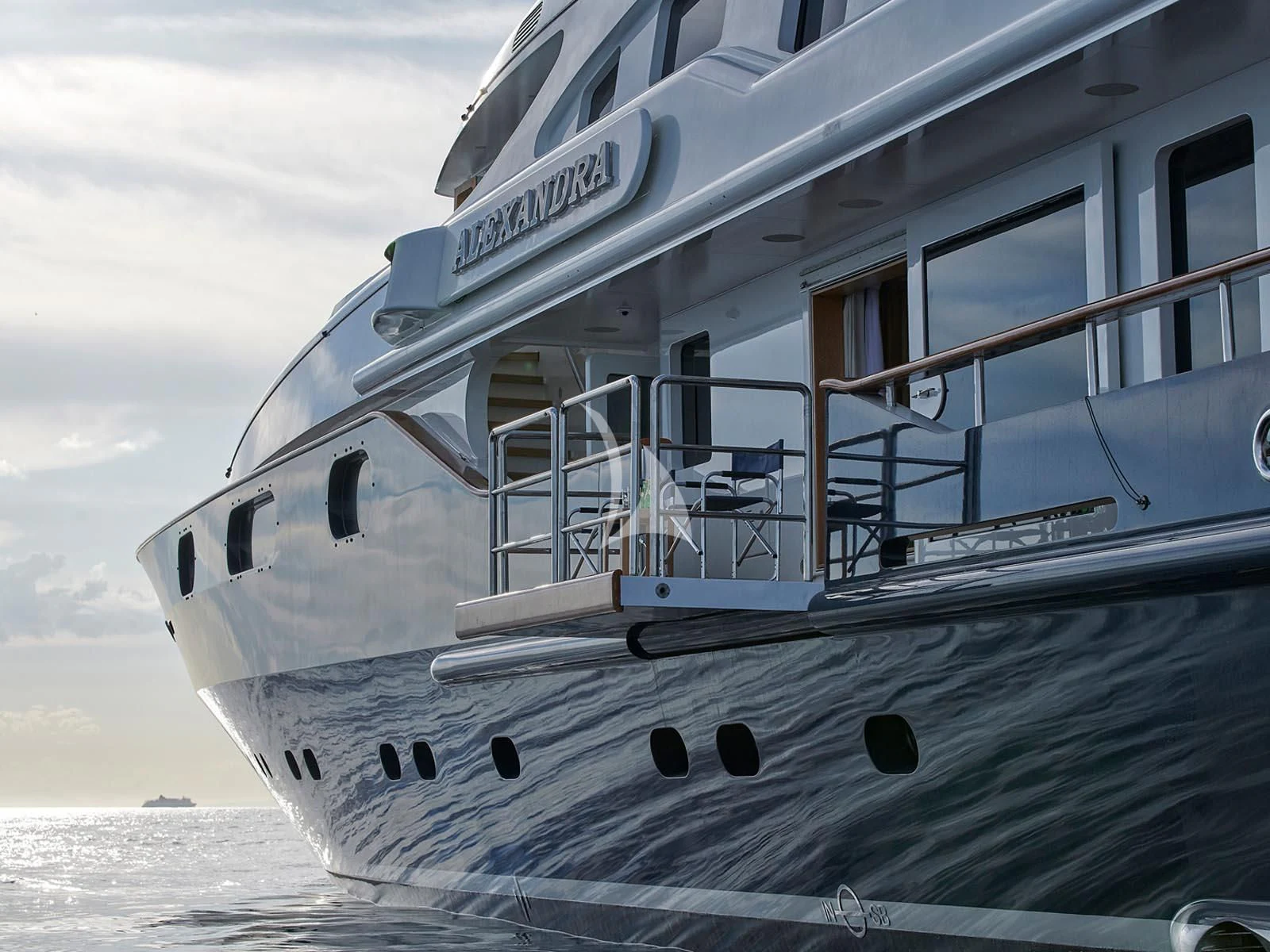 a large white boat on the water aboard ALEXANDRA Yacht for Charter