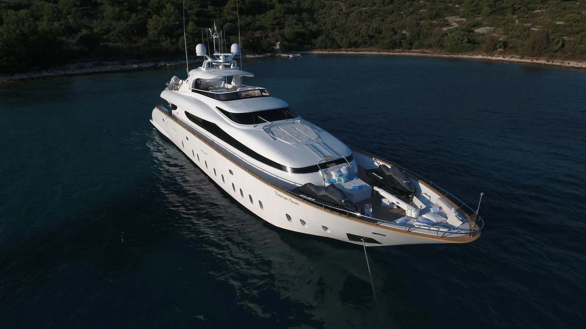 a white boat on water aboard TUSCAN SUN Yacht for Charter