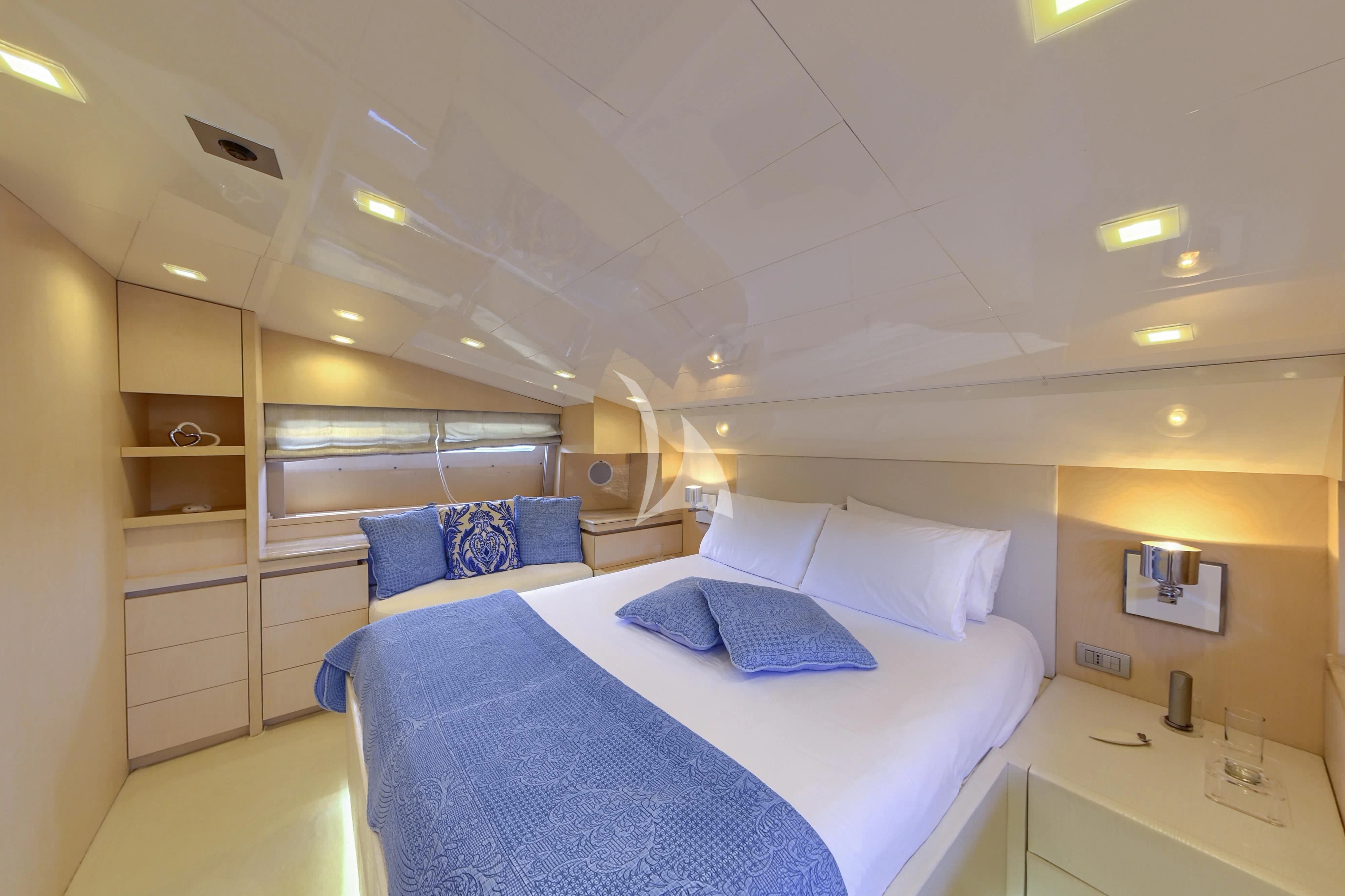 a room with a bed and a desk aboard TUSCAN SUN Yacht for Charter