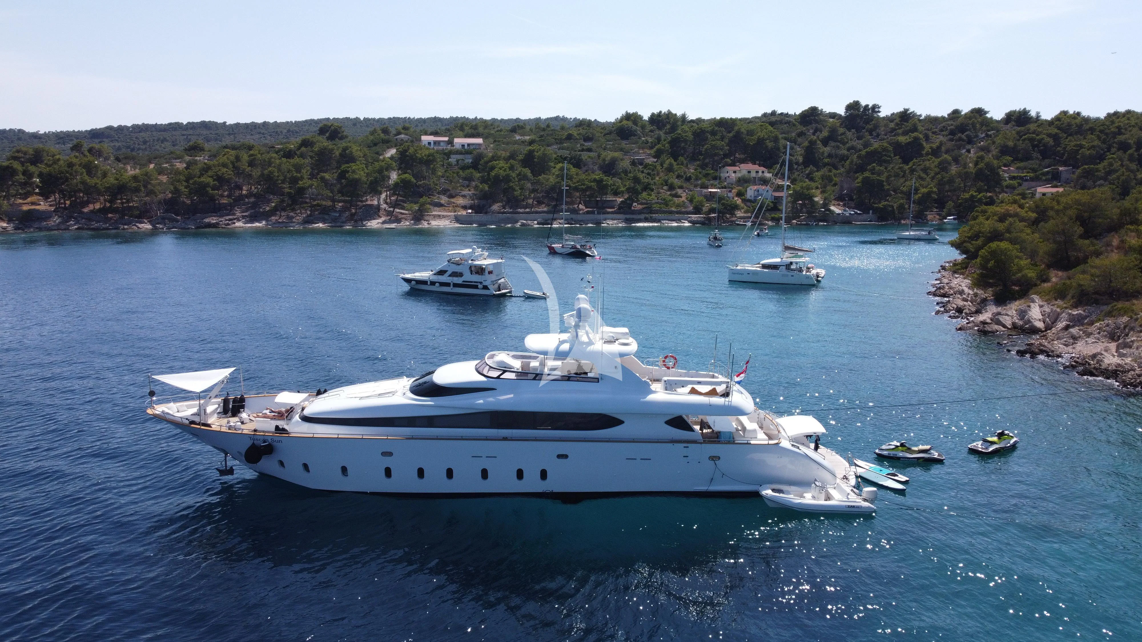 a group of boats in the water aboard TUSCAN SUN Yacht for Charter