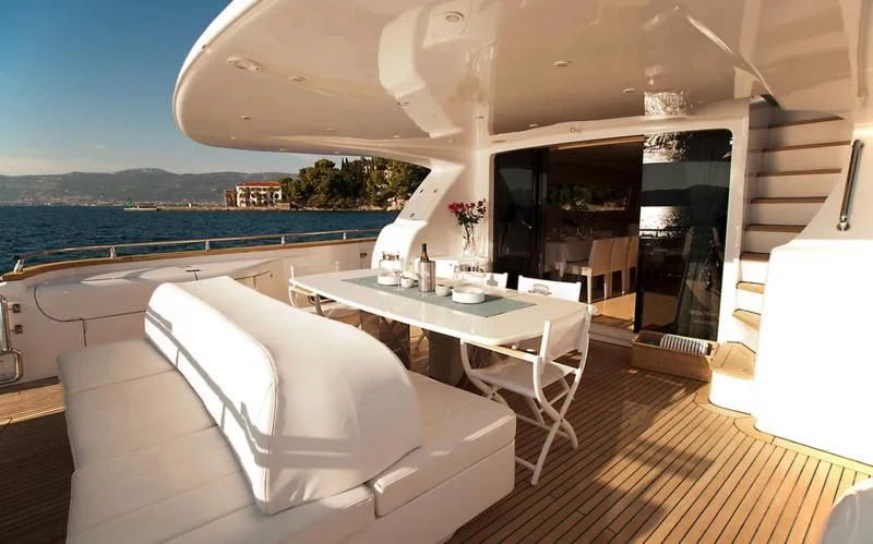 a room with a table and chairs aboard TUSCAN SUN Yacht for Charter