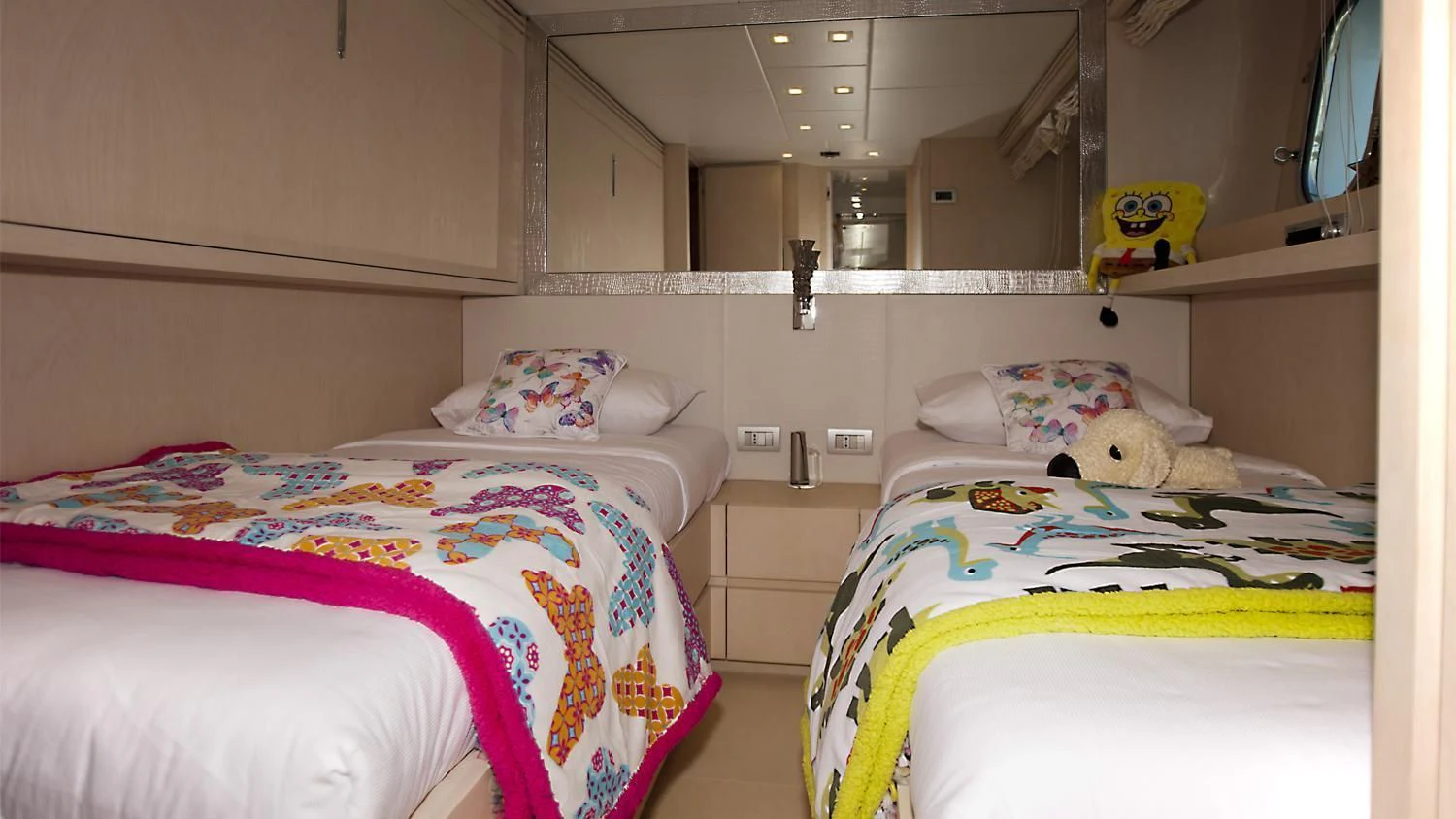 a couple of beds in a room aboard TUSCAN SUN Yacht for Charter