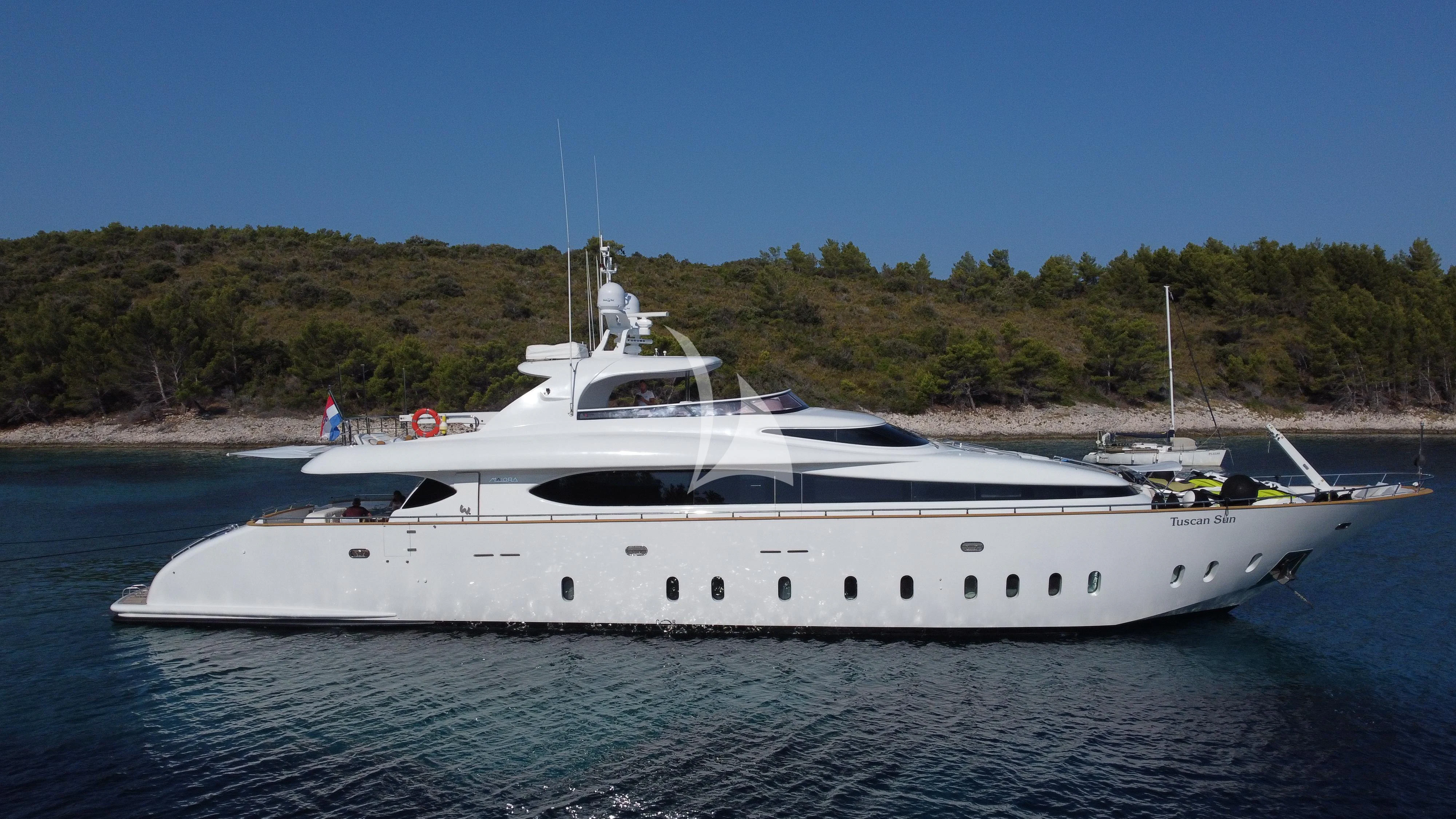 a white yacht on the water aboard TUSCAN SUN Yacht for Charter