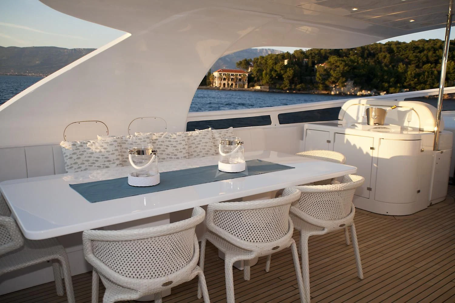 a table with chairs and a pool aboard TUSCAN SUN Yacht for Charter