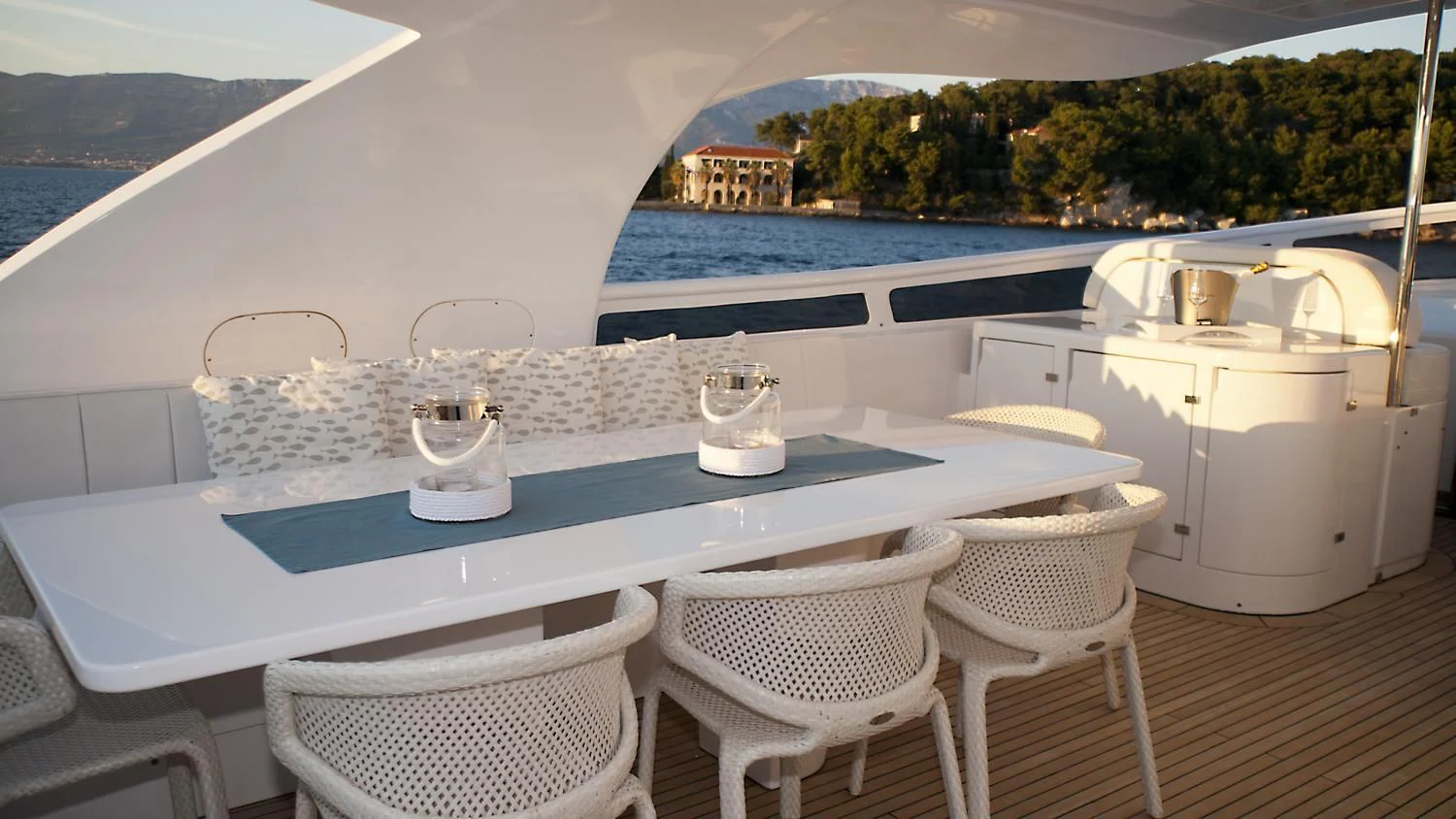 a table with chairs and a pool aboard TUSCAN SUN Yacht for Charter