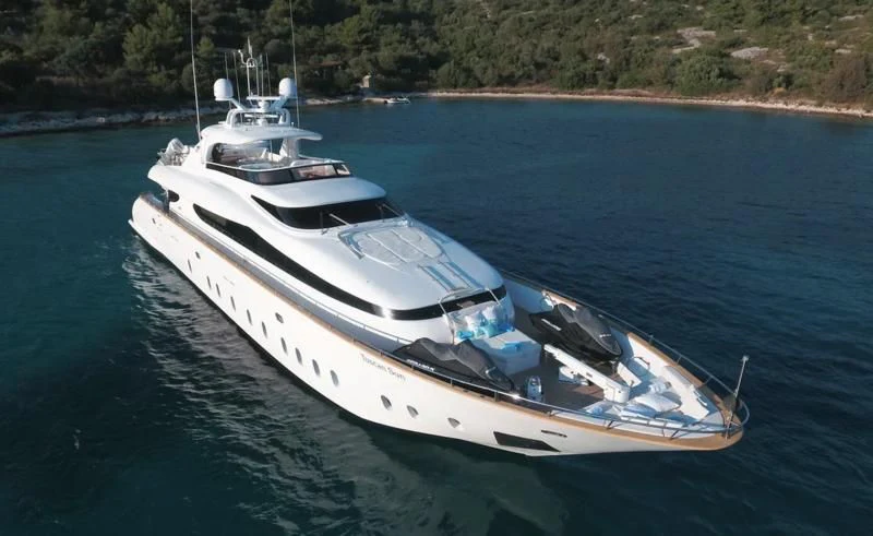 a white boat on the water aboard TUSCAN SUN Yacht for Charter