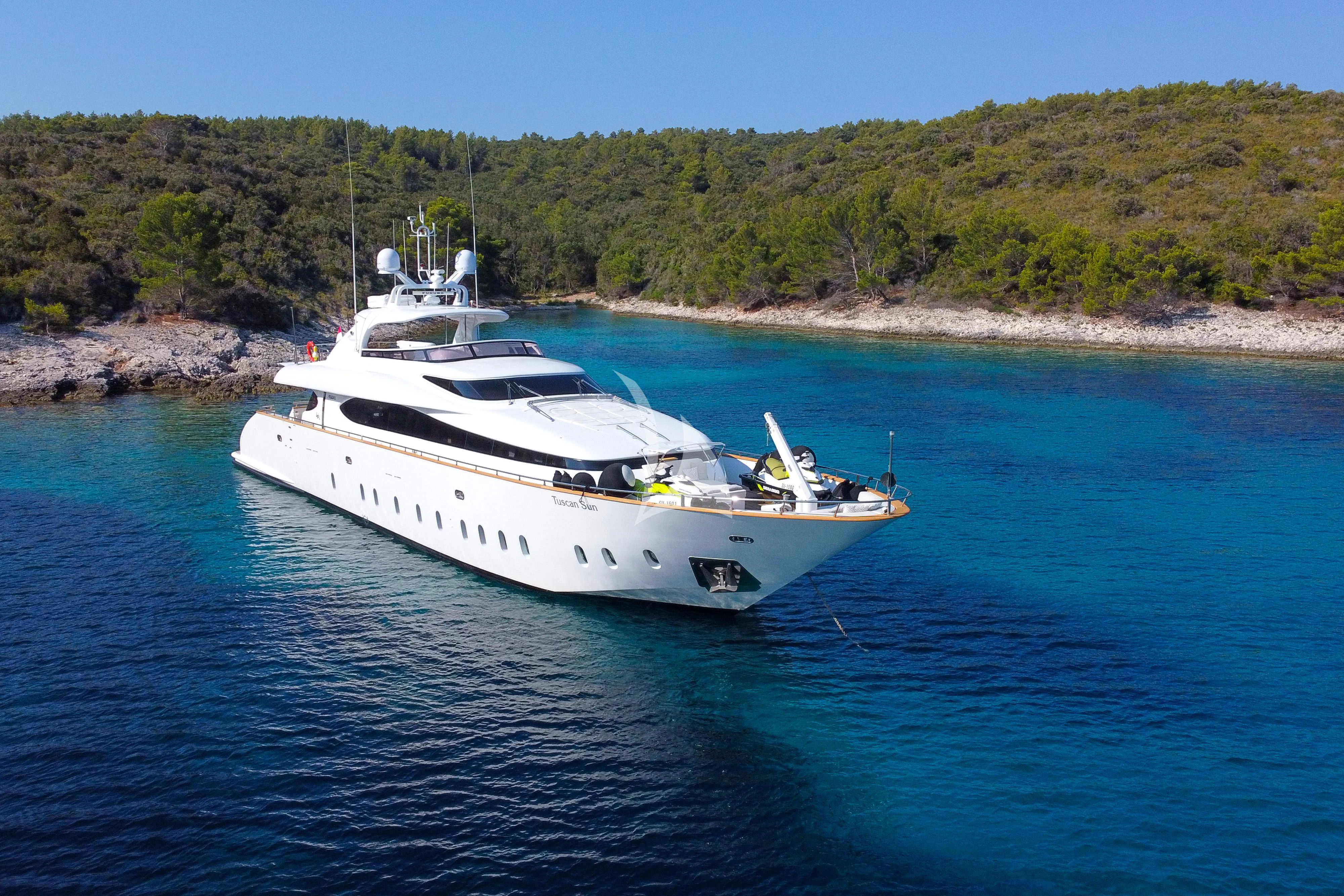 a white boat on the water aboard TUSCAN SUN Yacht for Charter