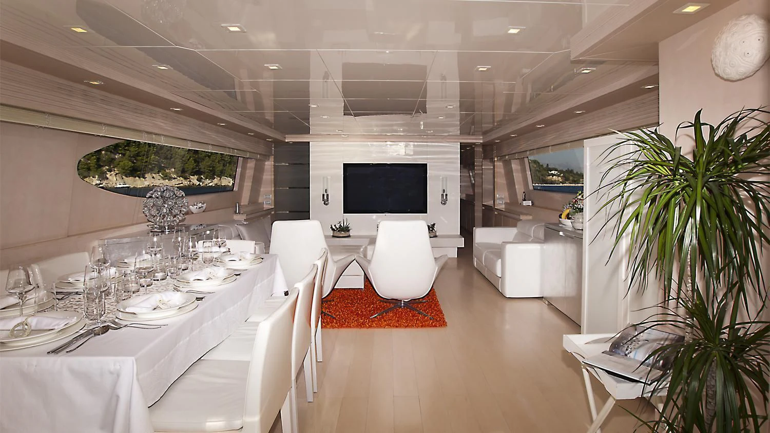 a room with tables and chairs aboard TUSCAN SUN Yacht for Charter