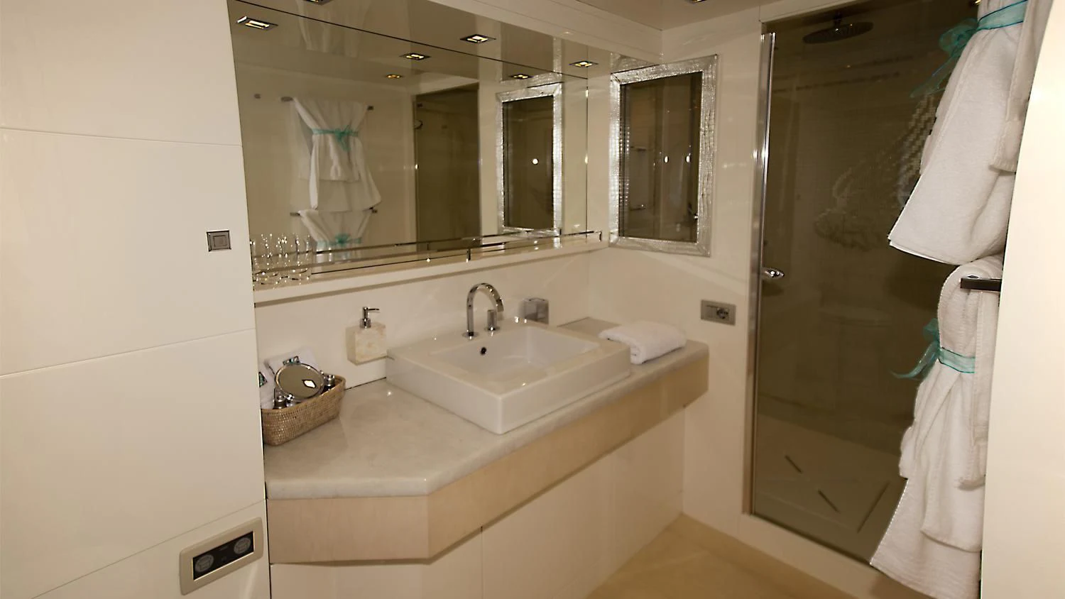 a bathroom with a sink and a mirror aboard TUSCAN SUN Yacht for Charter