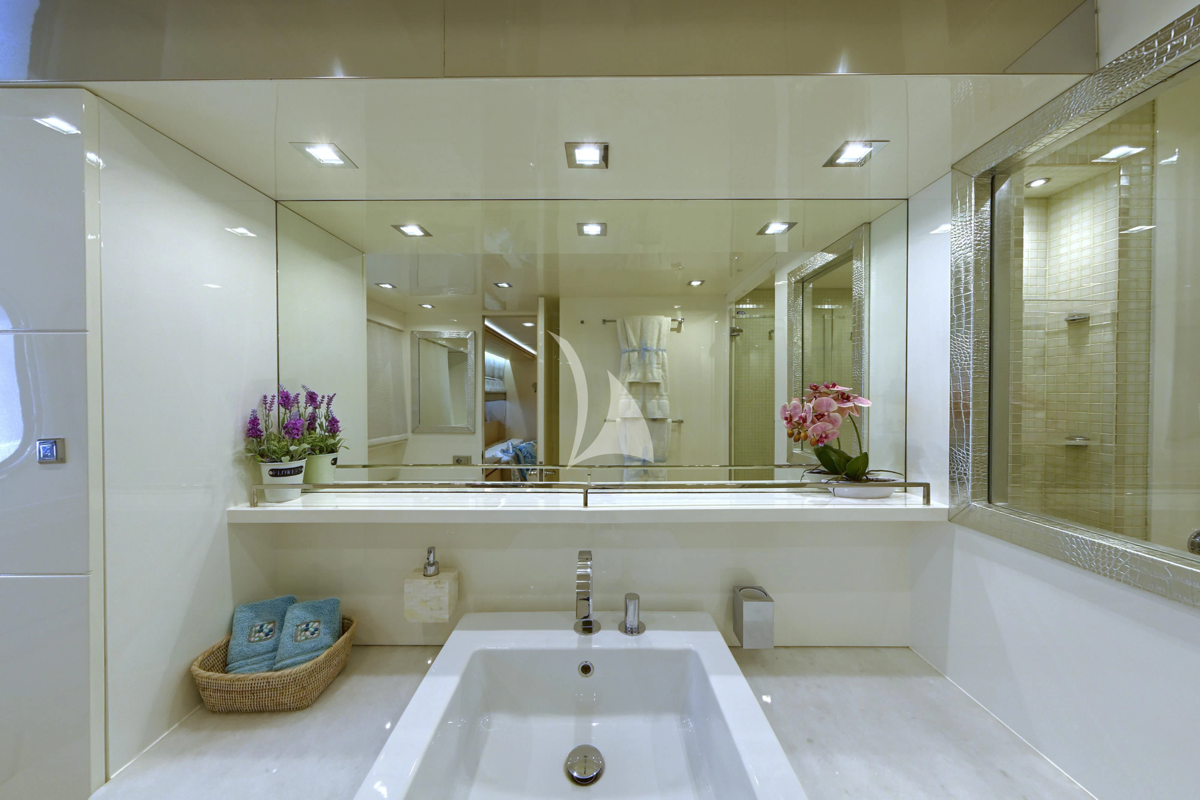a bathroom with a large mirror aboard TUSCAN SUN Yacht for Charter