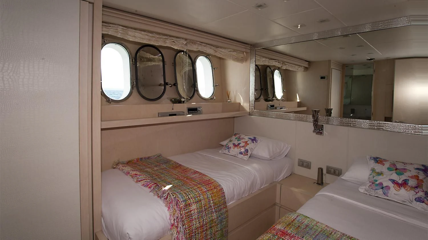 a couple of beds in a room aboard TUSCAN SUN Yacht for Charter