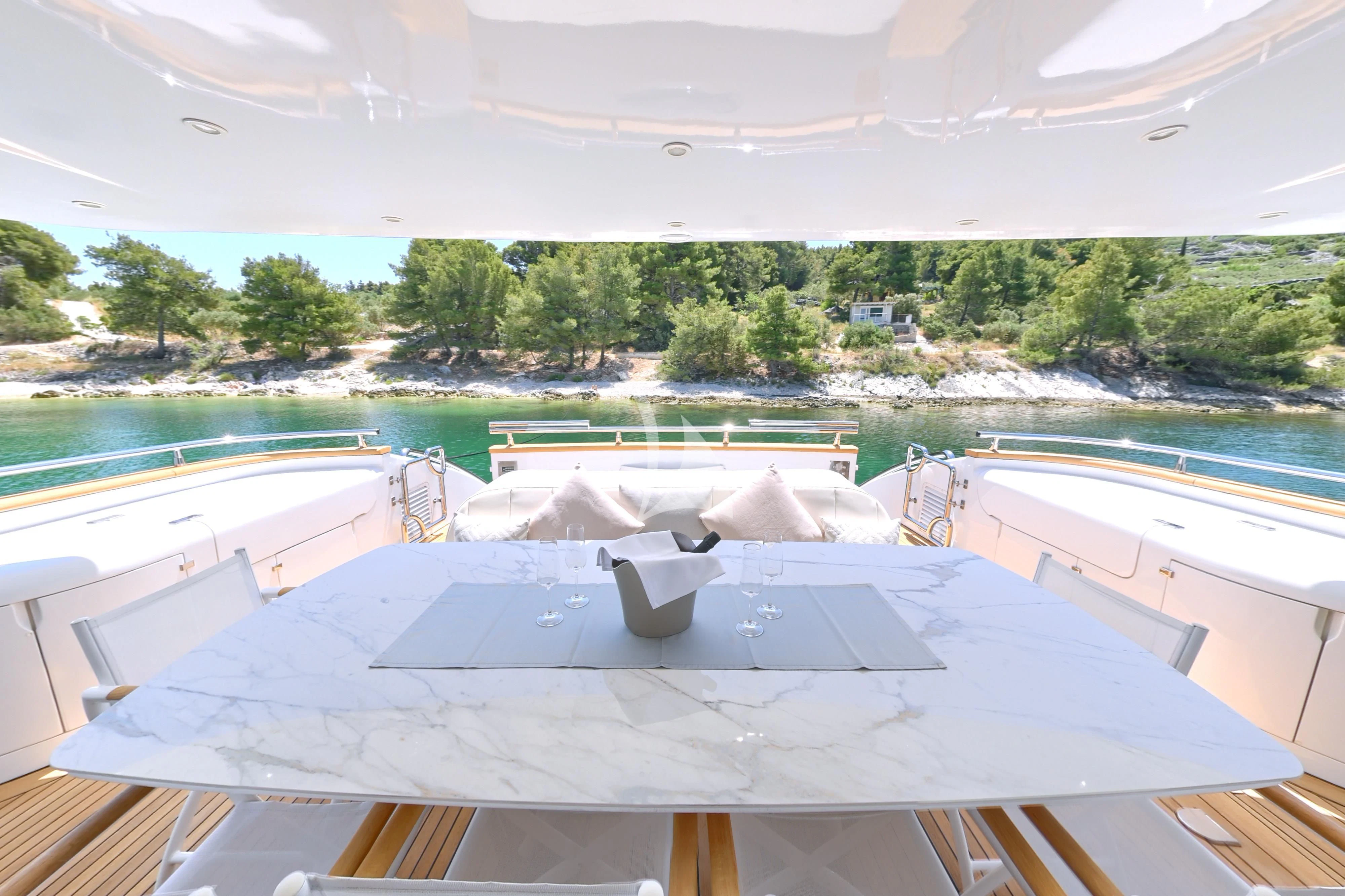 a pool with a large building in the background aboard TUSCAN SUN Yacht for Charter