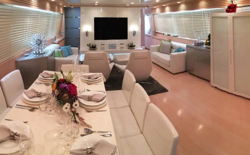 a large white dining room with a large table and chairs aboard TUSCAN SUN Yacht for Charter