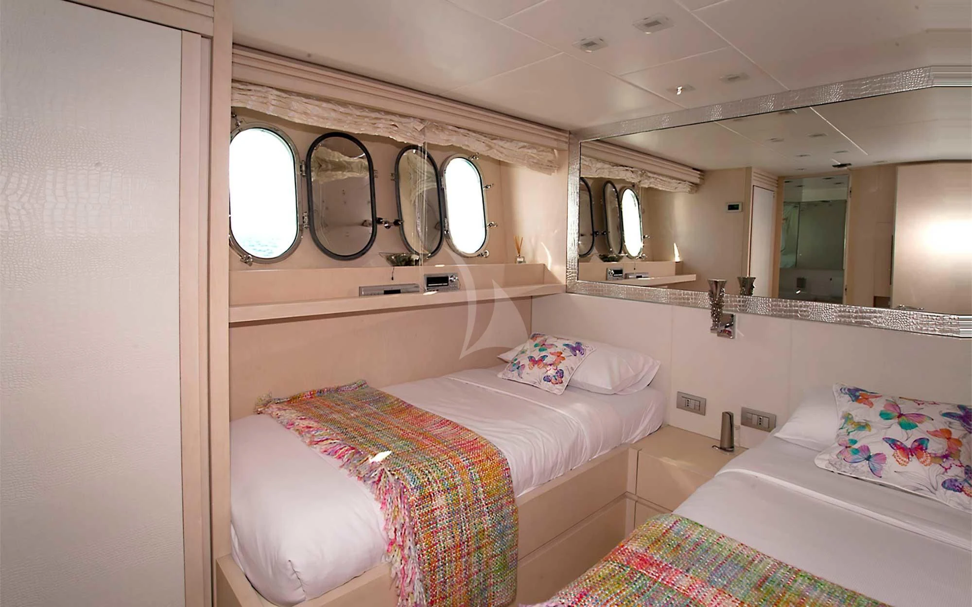 a couple of beds in a room aboard TUSCAN SUN Yacht for Charter