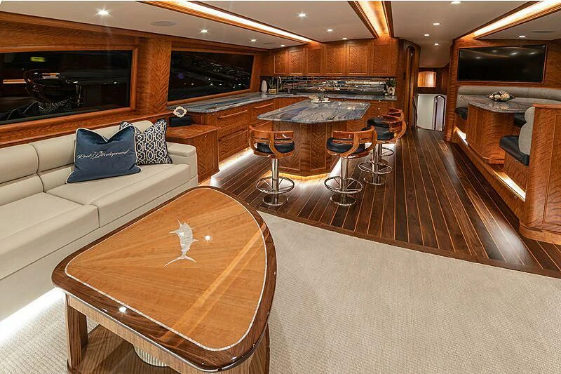 a living room with a couch and a table aboard REEL DEVELOPMENT Yacht for Sale