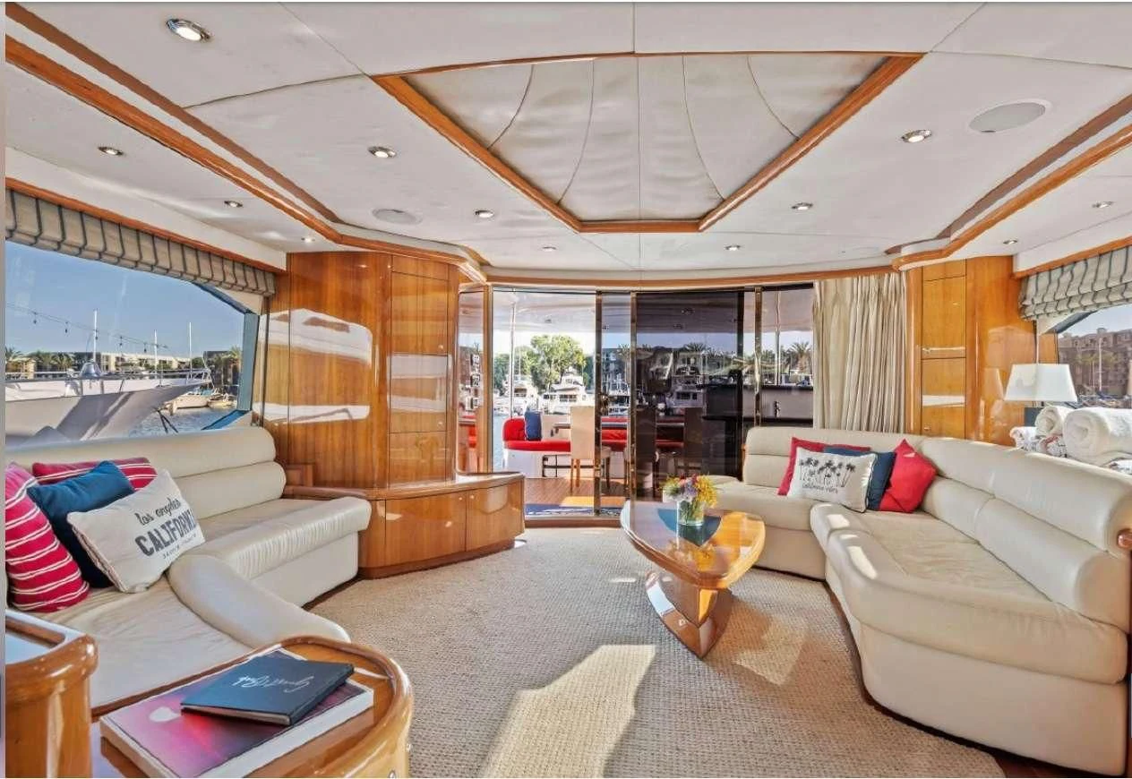 a living room with a large glass door aboard QUANTUM Yacht for Sale