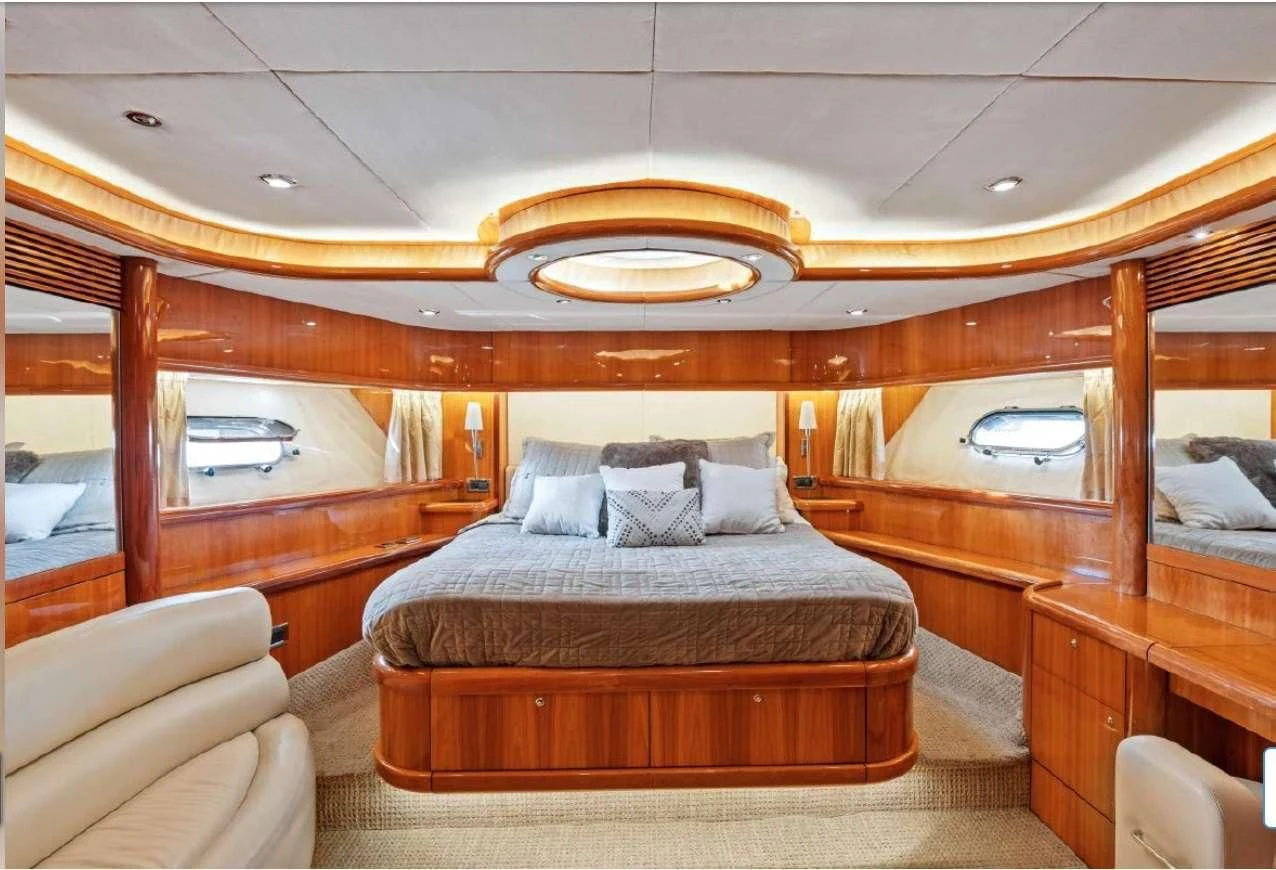 a large bedroom with a large bed aboard QUANTUM Yacht for Sale