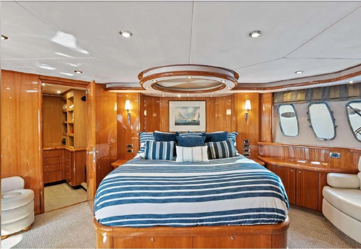 a large bedroom with a large bed aboard QUANTUM Yacht for Sale