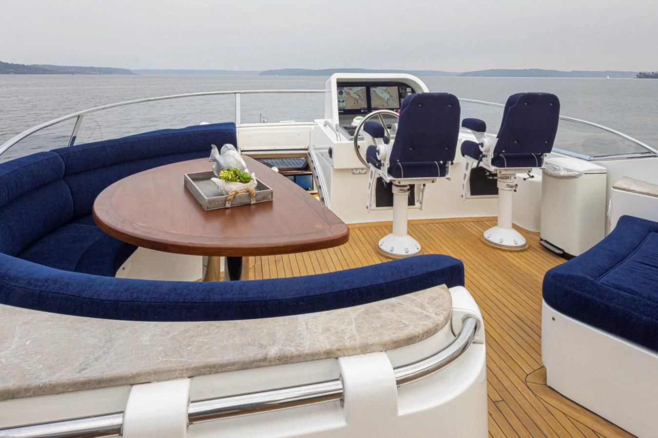 a table with chairs on it aboard UNDAUNTED Yacht for Sale