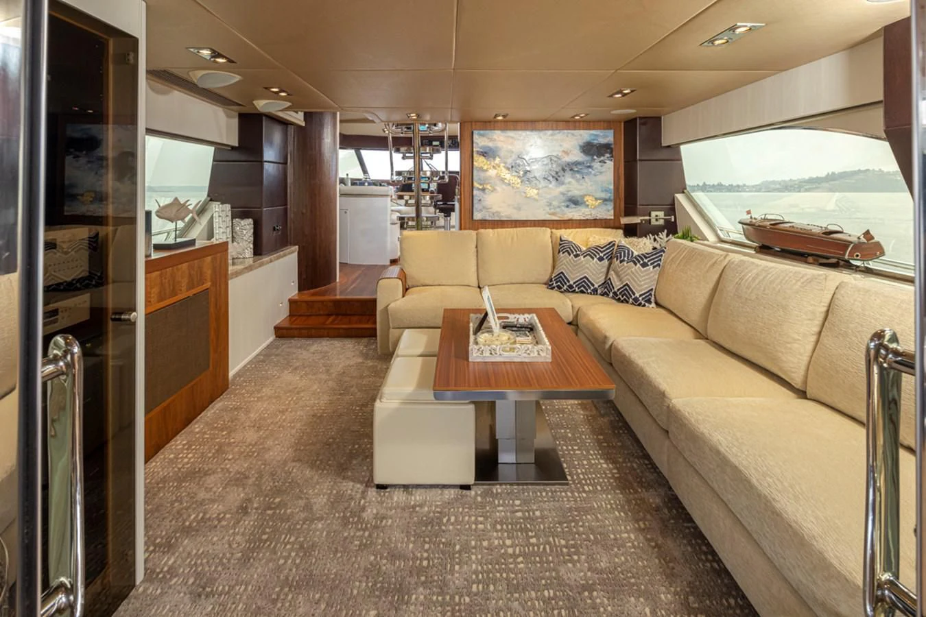 a living room with a couch and a table aboard UNDAUNTED Yacht for Sale
