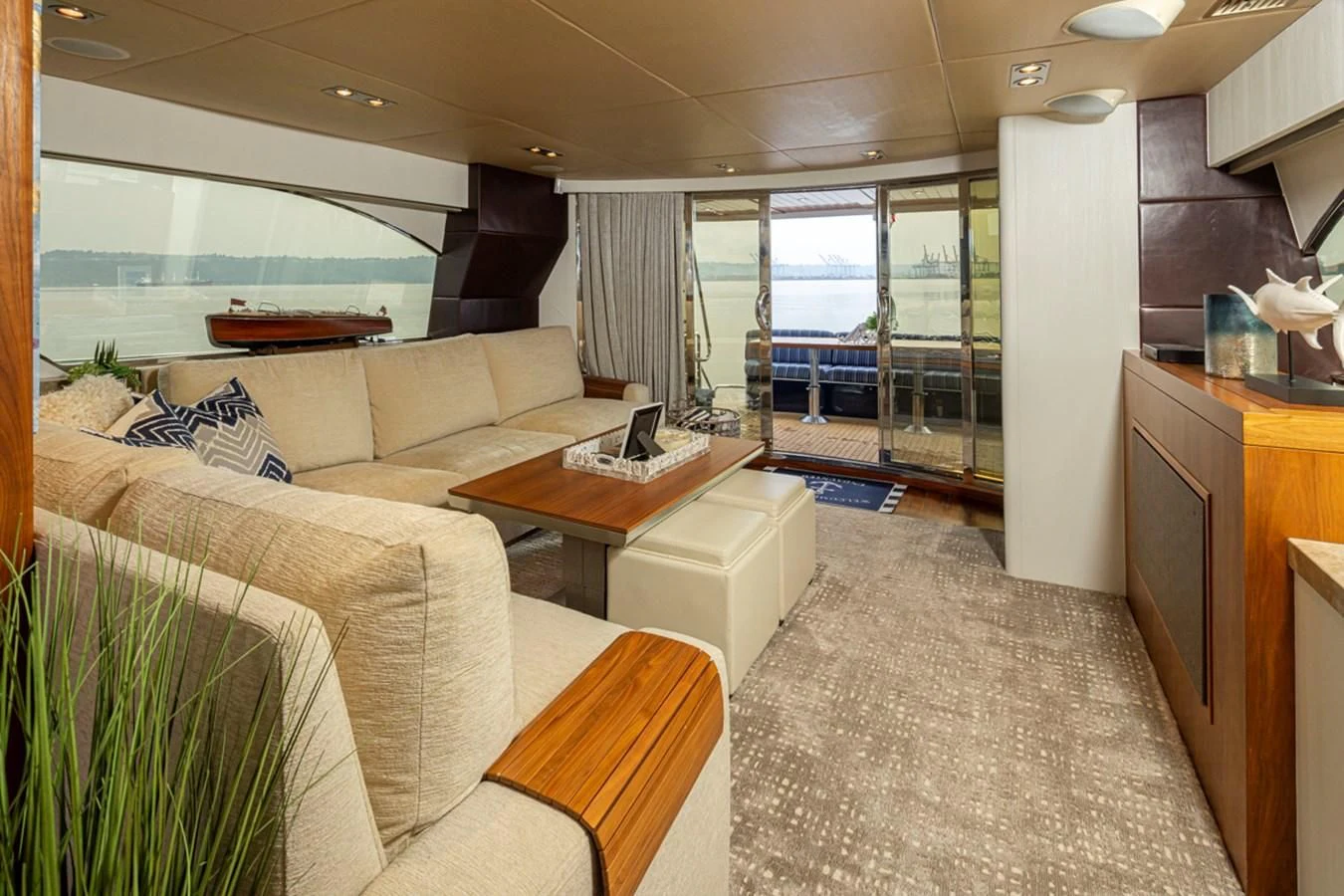 a living room with a large window aboard UNDAUNTED Yacht for Sale