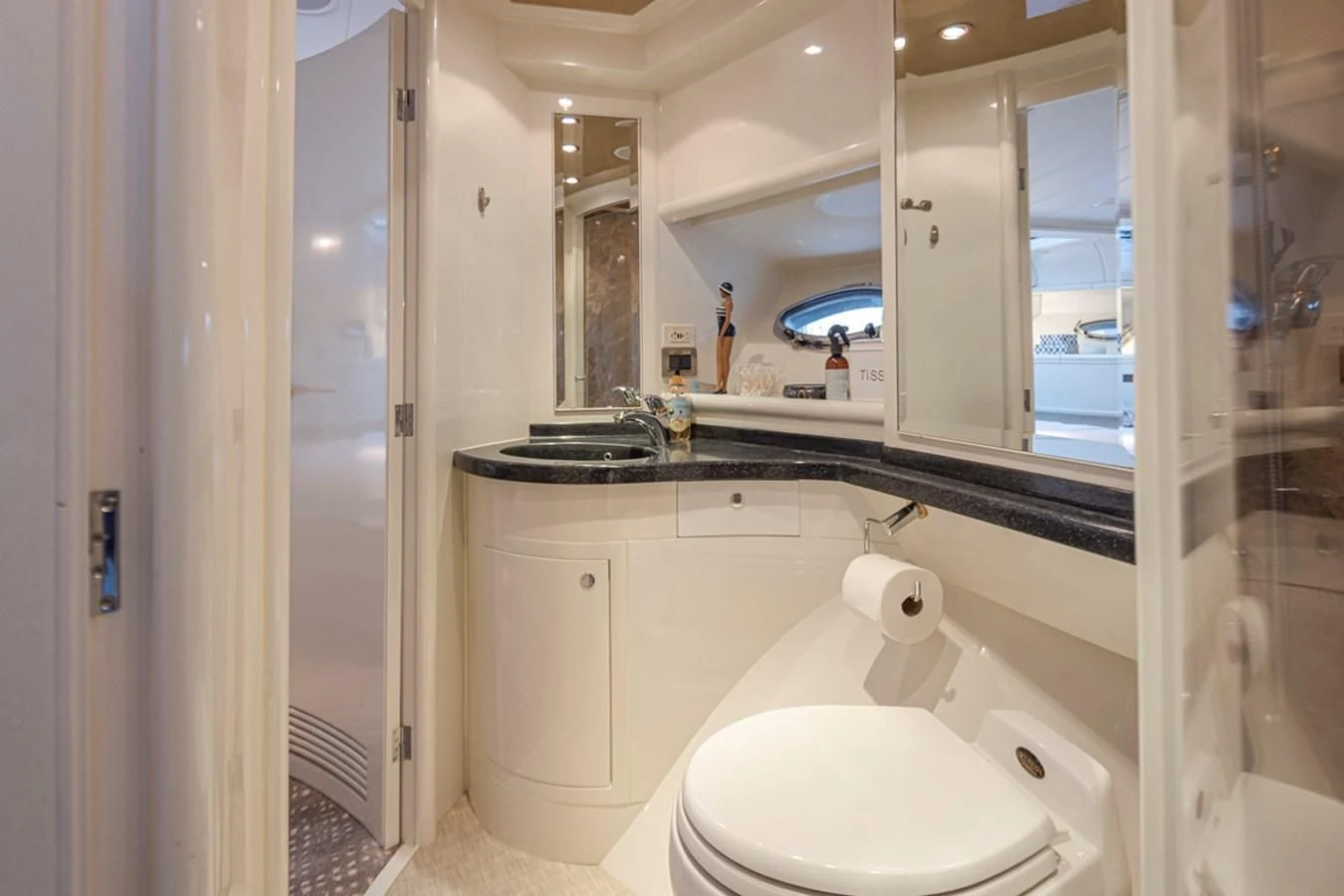 a bathroom with a large mirror aboard UNDAUNTED Yacht for Sale