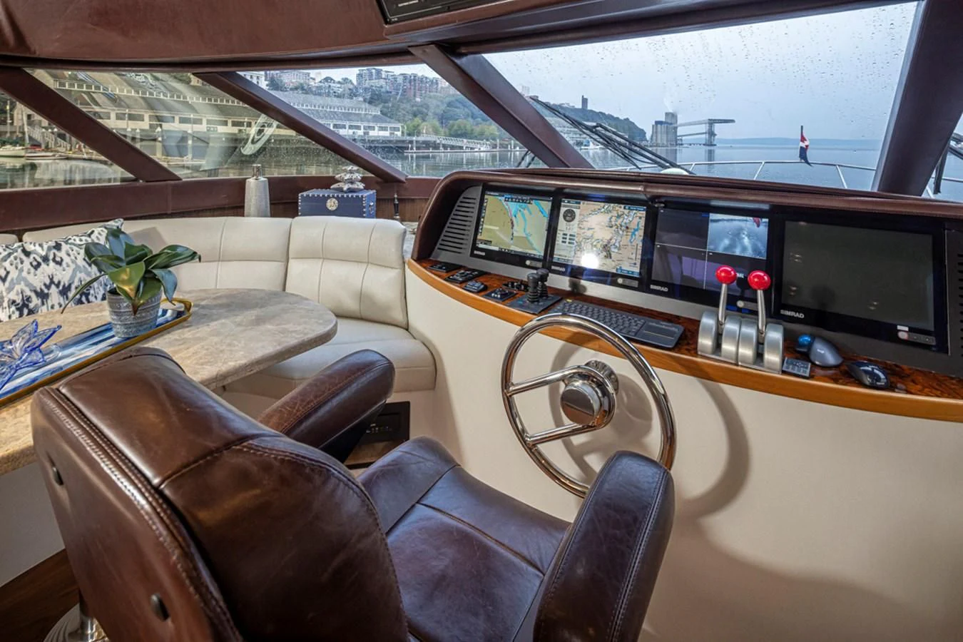 a living room with a large window aboard UNDAUNTED Yacht for Sale