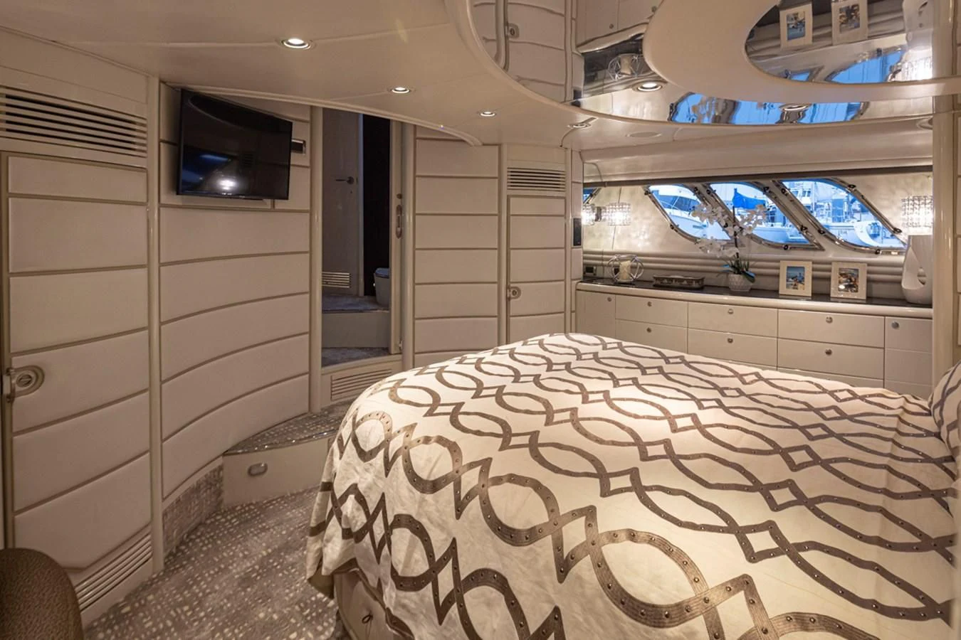 a room with a bed and a dresser aboard UNDAUNTED Yacht for Sale